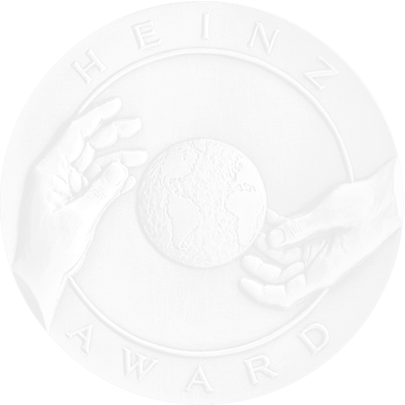 heinz award medallion showing two hands around the earth